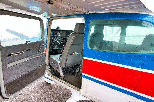 small plane on aiport field. CESNA Blue white Red