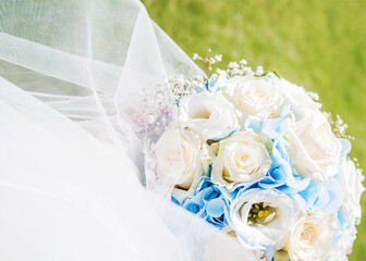 White wedding flower bouquet.Wedding flower bouquet outdoors on a background of green grass. Wedding flower.