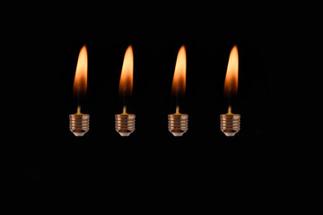 Fototapeta premium Bulb screw with candle flame. 