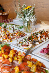 Traditional Apulean antipasti served on table during Italian wedding or celebration, above view