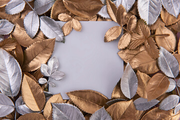 Creative layout gold and silver leaves on the white background. 