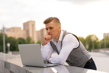 Business. Businessman Using Laptop Outdoors. Modern Technology Concept