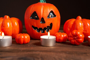 Halloween background, orange decorative plastic pumpkin black paper Thanksgiving greeting card