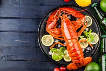 Seafood feast，Lemon and fresh Boston lobster on the ice