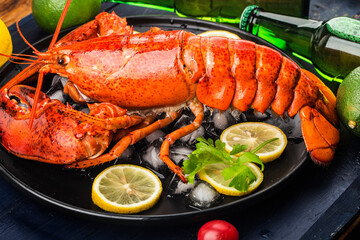 Seafood feast，Lemon and fresh Boston lobster on the ice