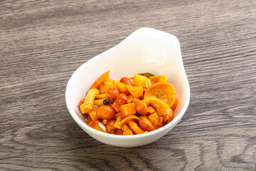 Marinated pickled honey mushrooms in the bowl