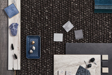 Stylish flat lay composition of architect moodboard with samples of building, brown textile and natural materials and personal accessories. Top view, template.