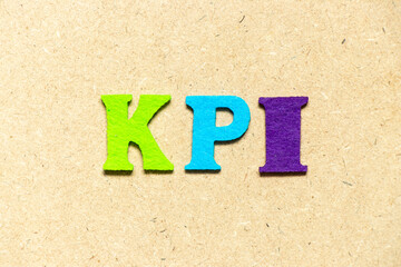 Color cloth alphabet letter in word KPI (Abbreviation of key performance indicator) on wood...