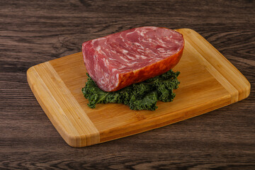 Beef ham piece over board