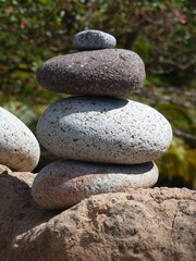 Fototapeta na wymiar Meditation stones stapled on tropical beach