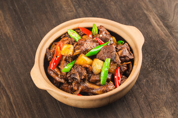 Stewed duck with potatoes in casserole