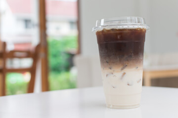 Drinks are set on a white table. and blur the roof background