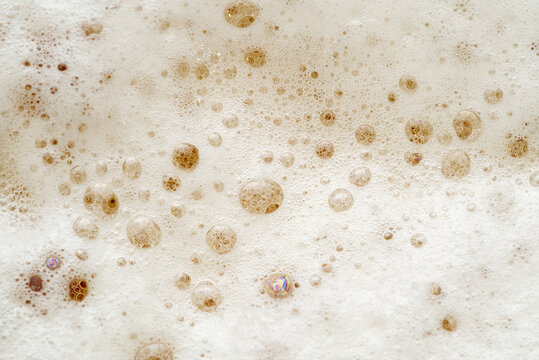 Fresh Beer foam texture. eer foam background. Macro detail of beer bubble and foam.
