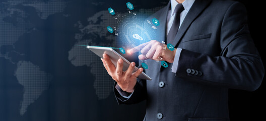 Businessman holding tablet showing hologram diagram. Social digital, Analysis strategy sale marketing and economic data online network connection. Business finance and digital technology concept.