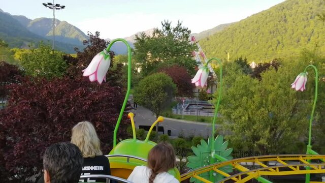 GABALA, AZERBAIJAN - Aug 10, 2021: An HD video of the reaction of people to a moving attraction in luna park in Gabala, Azerbaijan