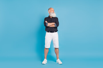 Full size photo of dreamy happy positive old man look empty space sale news isolated on blue color background