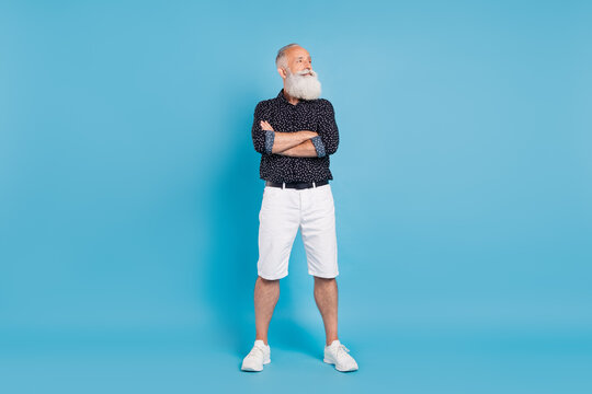 Full size photo of dreamy happy positive old man look empty space sale news isolated on blue color background