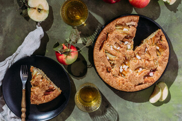 Apple pie. Sponge cake with apples on a green background