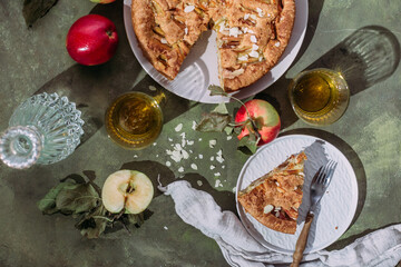 Apple pie. Sponge cake with apples on a green background
