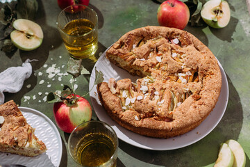 Apple pie. Sponge cake with apples on a green background