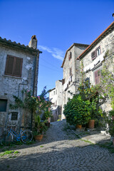 Fototapeta na wymiar A narrow street in Bracciano, an old town in Lazio region, Italy.