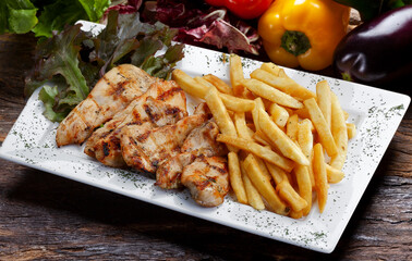 Grilled chicken with potato on isolated background