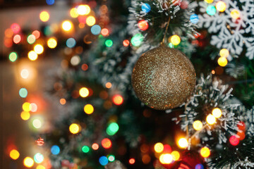 Christmas ball hanging on christmas tree. Bokeh.