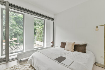 Light bedroom with large windows