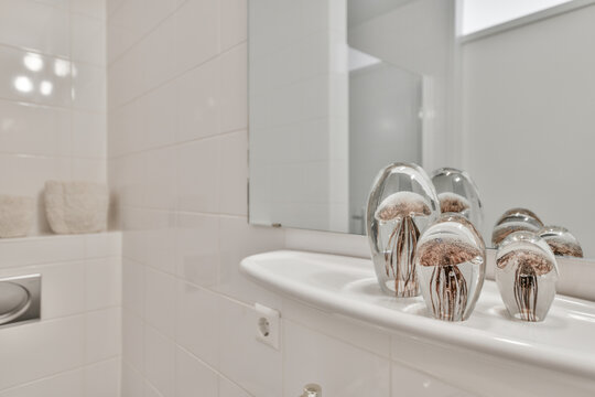 Decorative glass jellyfish placed in bathroom