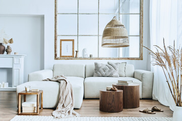Stylish interior of living room with design modular sofa, furniture, wooden coffee table, rattan...