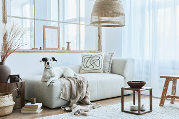 Stylish interior of living room with design modular sofa, furniture, coffee table, rattan...