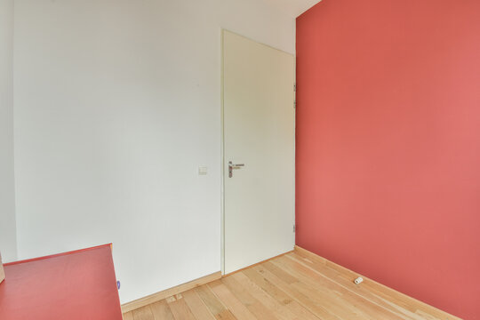 Empty room interior with door and parquet