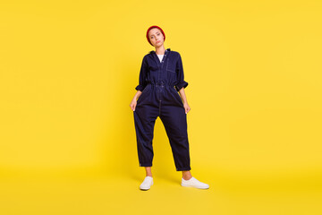 Full size photo of young unhappy depressed girl beggar unhappy with her clothes isolated on yellow...
