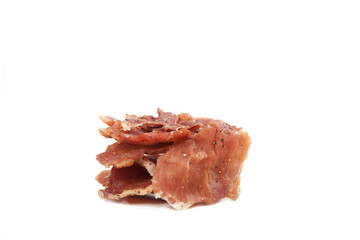 Pieces of jerky are stacked on a white background. Isolate.