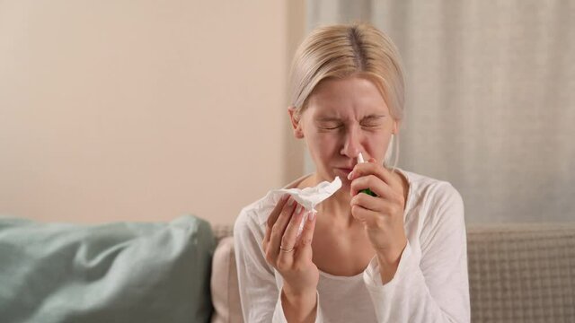 Young European Woman Covered With Blanket Sneezing Blowing Nose