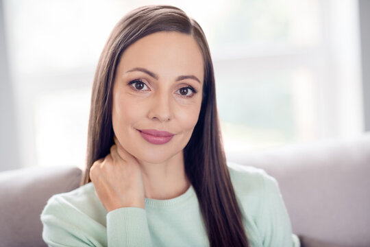 Photo of optimistic young brunette lady hand neck wear blue shirt at home alone