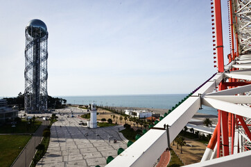 BATUMI, GEORGIA: Scenic street photography of Batumi city center with skyscrapers and old buildings  on summer sunny day with mountains in the background 