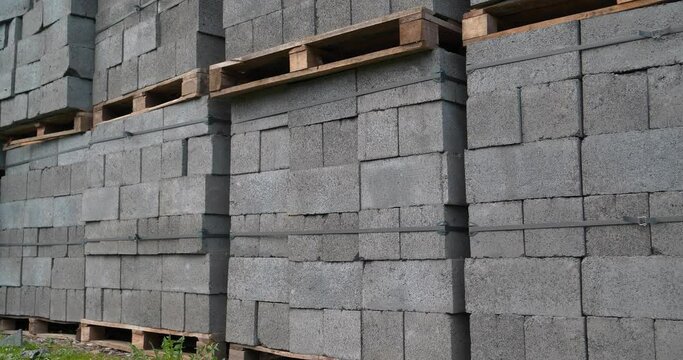 Grey slag stones in stacks at outdoor construction supermarket. Cinema 4K 60fps video