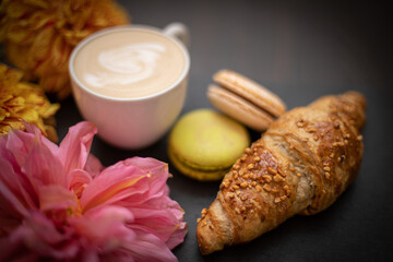 Fototapeta na wymiar Croissants and coffee in a cozy cafe