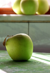 green apples on a table