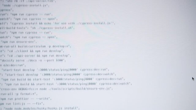Computer code running over white screen of laptop