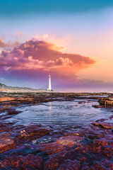 Scenic lighthouse landscape and sunset view along world famous coastline. Cape Town, South Africa is a wonderful travel destination for nature, adventure and tourism.