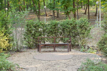 Wooden bench for rest and meditation against the background of l