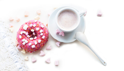 Romantic breakfast with pink donuts, cocoa and pink marshmallows in the shape of heart on white background. Breakfast for Valentines Day. Top view