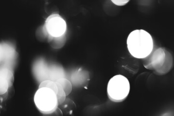 Blurred lights black and white background. Abstract bokeh with soft light