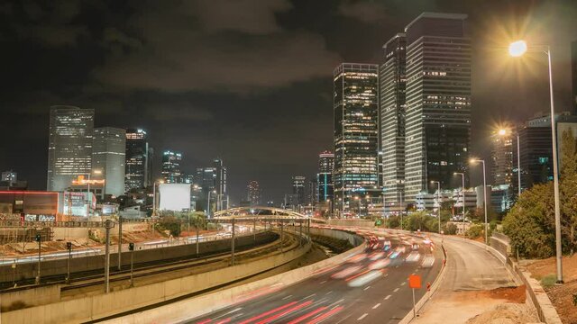 NIght city timelapse, highway traffic, skycrapers horizon in Tel Aviv Yafo, Israel