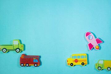Top of View wooden toy cars and sea animals on blue background. Toys in table.