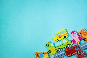 Top of View wooden toy cars and sea animals on blue background. Toys in table.