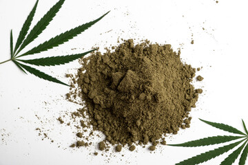The concept of proper nutrition. A scattering of hemp flour on a white background with cannabis...