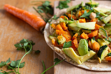 Vegan burrito with chickpeas, zucchini, carrots and avocado